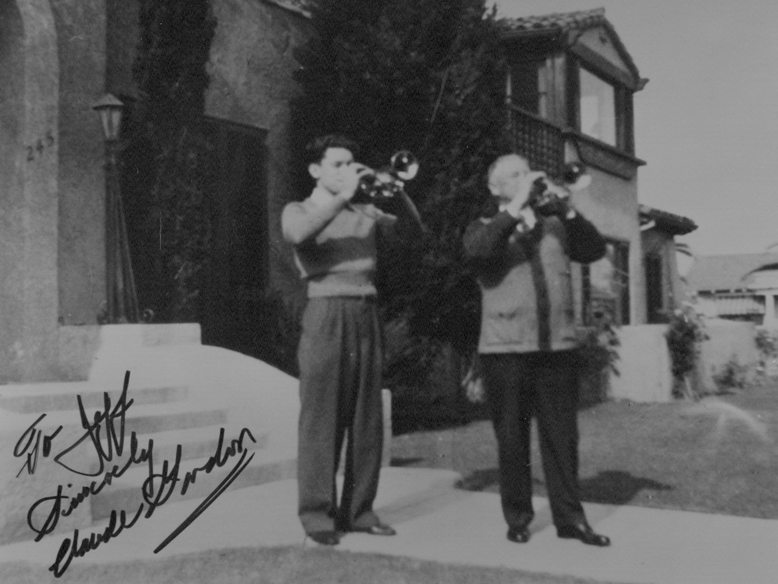 Claude Gordon and legendary cornetist Herbert L. Clarke playing together outside Clarke's Long Beach home, representing the historic Clarke–Gordon trumpet pedagogy tradition.