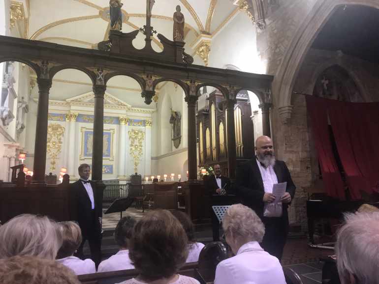 Conductor Harry Mills introduces Jeff Purtle and David Bertie