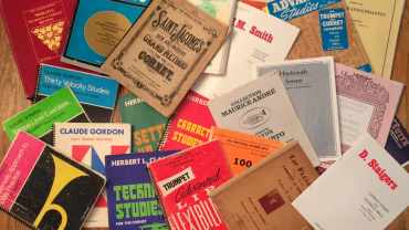 What to Practice - photo of various trumpet and brass method books and solos